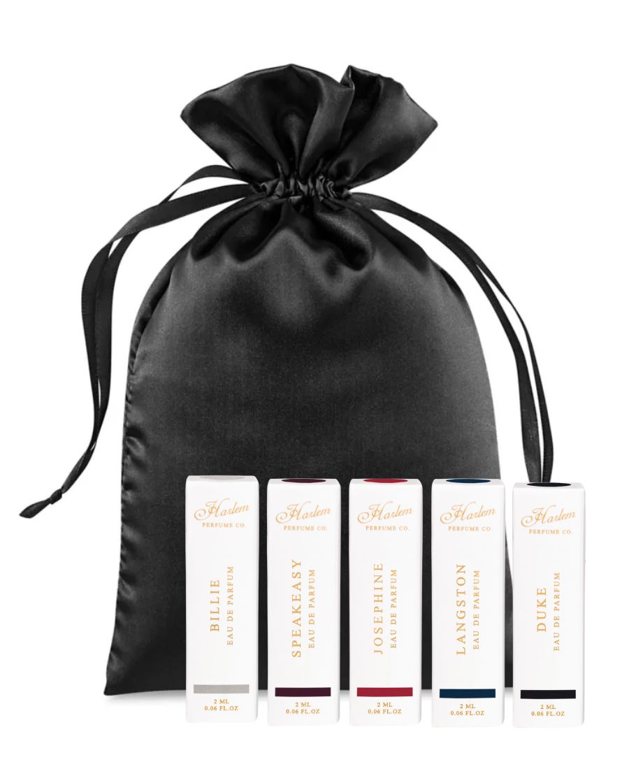 This is an image of the Billy, speakeasy, Josephine, Langston, and Duke to ML perfume samples with a black satin bag against a white background.