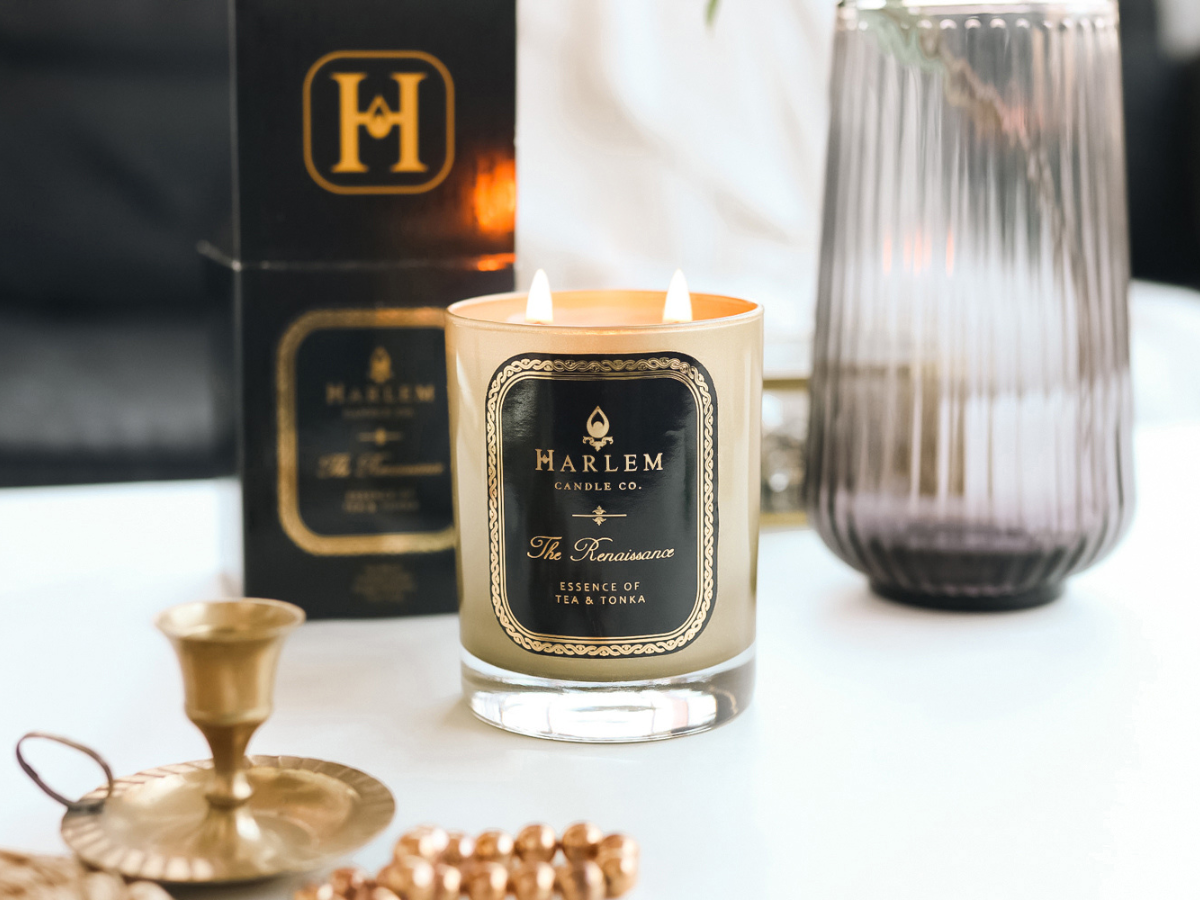 This is an image of our 2 wick Renaissance candle pictured next to its decorative box in a lifestyle setting.