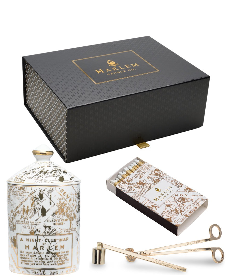 Image of the Speakeasy Ceramic Gold gift set with Harlem Candle Co branded Wick Trimmer and Candle Snuffer set.  The box also includes the gold and white Nightclub Map of Harlem matches.