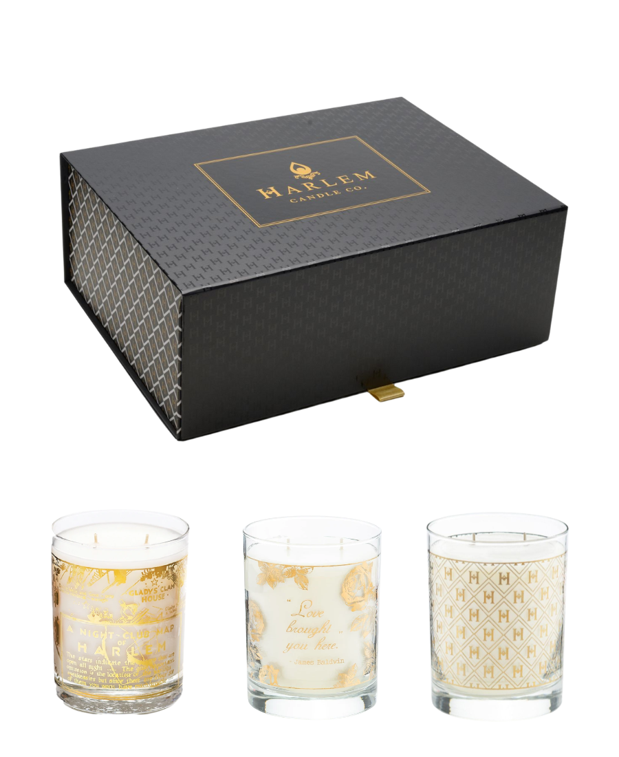 Our 22K Gold Cocktail collection of three 12 oz candles. Our 12 oz Speakeasy 22K Cocktail with the H pattern etched in gold, our Savoy 12 oz candle and our Love Brought You Here James Baldwin Candle all 2 wick, side by side on a white background. In a black giftbox.