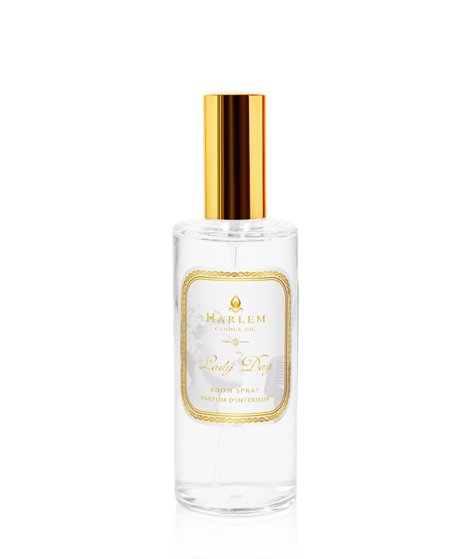 Our clear bottle of 4 oz Lady Day room spray with a gold top and the essence of white gardenia on a white background.