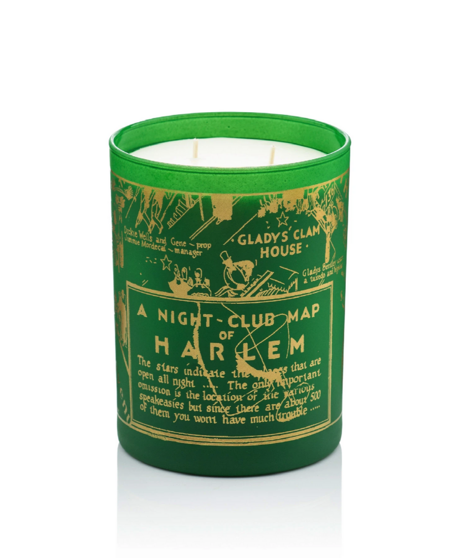 Green glass 12 oz Holiday candle with the nightclub map of harlem painted in 24K gold on the green glass on a white background