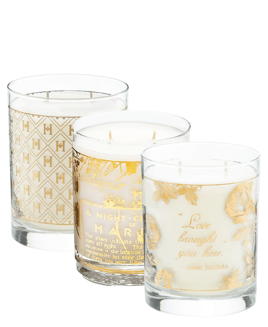 Our 22K Gold Cocktail collection of three 12 oz candles.  Our 12 oz Speakeasy 22K Cocktail with the H pattern etched in gold, our Savoy 12 oz candle and our Love Brought You Here James Baldwin Candle all 2 wick, side by side on a white background.