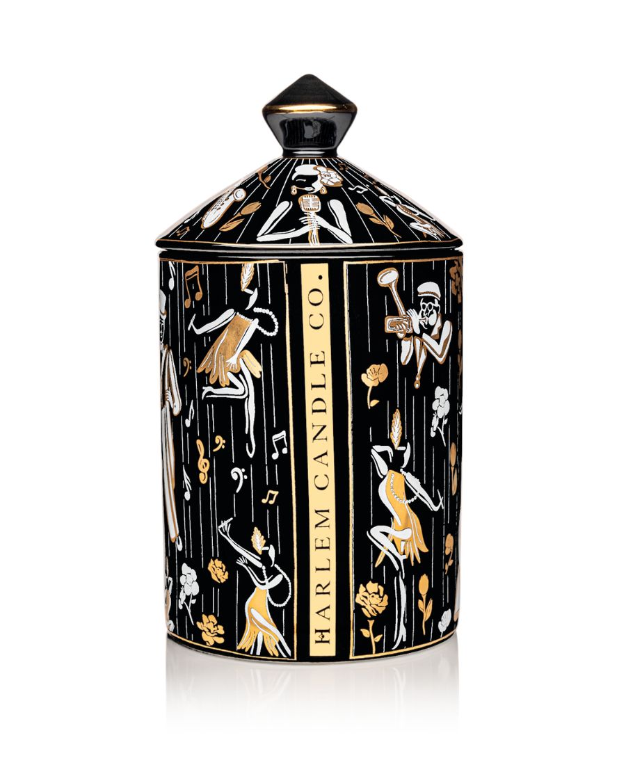 This is an image of our black gold and white Duke, ceramic candle with a lid. It features illustrations of Billie Holiday, the savoy ballroom, Duke Ellington, and other original illustrations.  This is the back of the candle with the words Harlem Candle Co