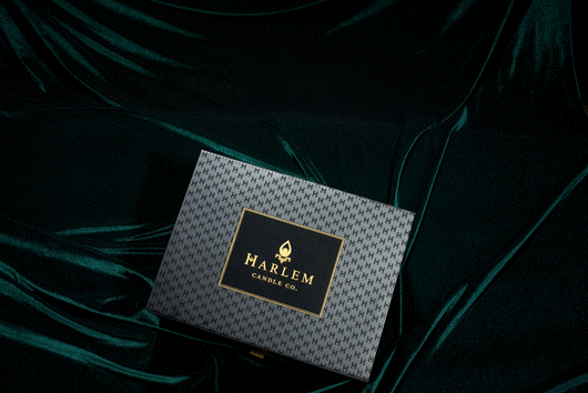 This is a moving image of our gorgeous black H pattern Harlem Candle Co box, showing how to put it together with its magnetic closures.  The contents in the box are the holiday candle, holiday diffuser, holiday room spray, and holiday, travel candle.