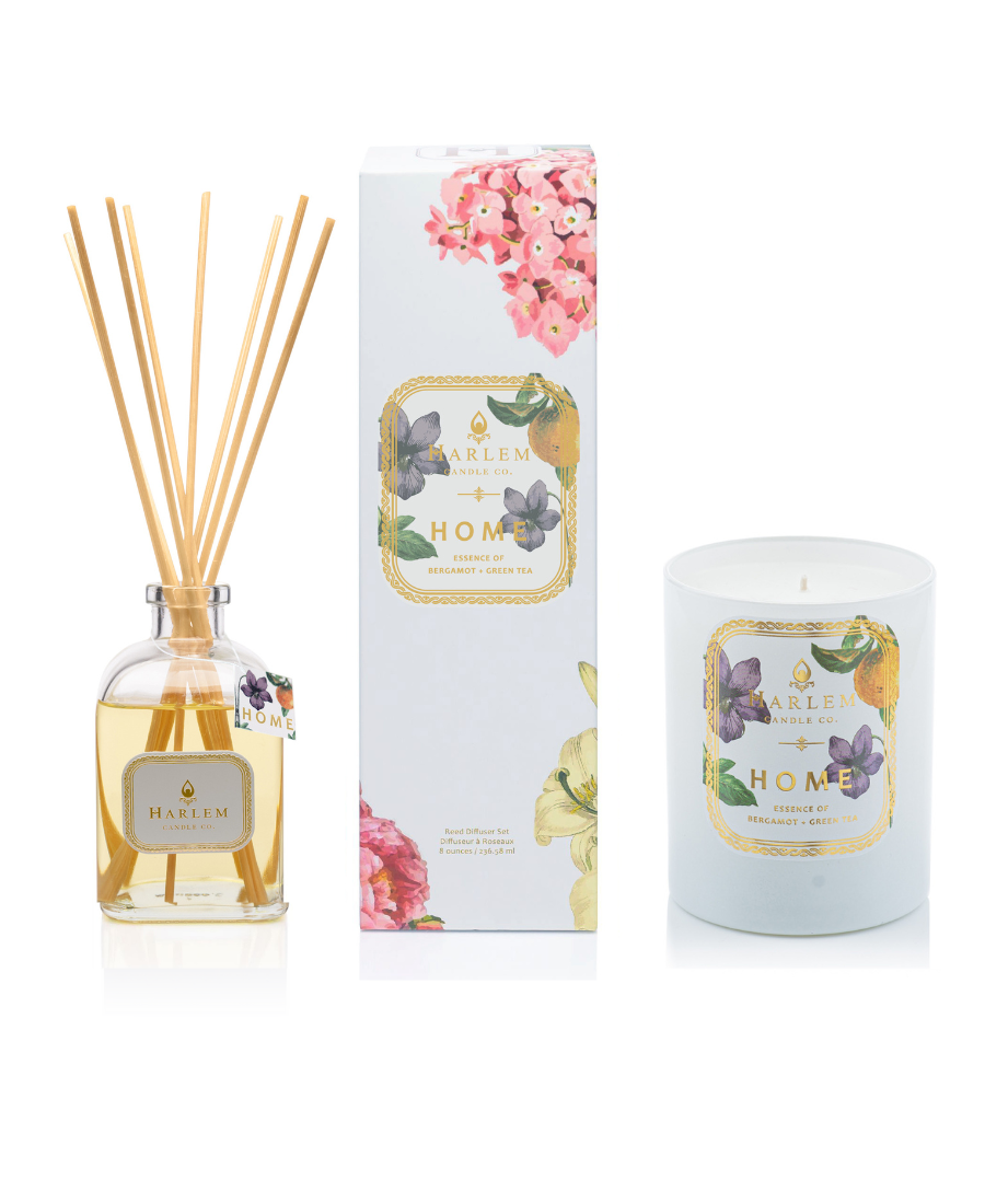 This is an image of The "Home" Reed Diffuser and Candle Bundle with a clear, glass diffuser bottle and a one wick candle. 