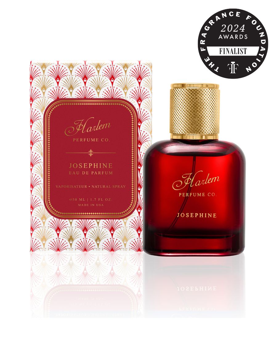 Image of Josephine eau de parfum - in a red translucent bottle with a gold cap. It is pictured next to it's decorative box with a gold and red art deco design.