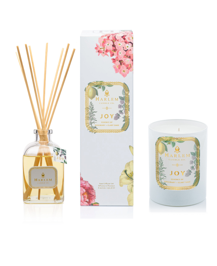This is an image of The "Joy" Reed Diffuser and Candle Bundle with a clear, glass diffuser bottle and a one wick candle. 