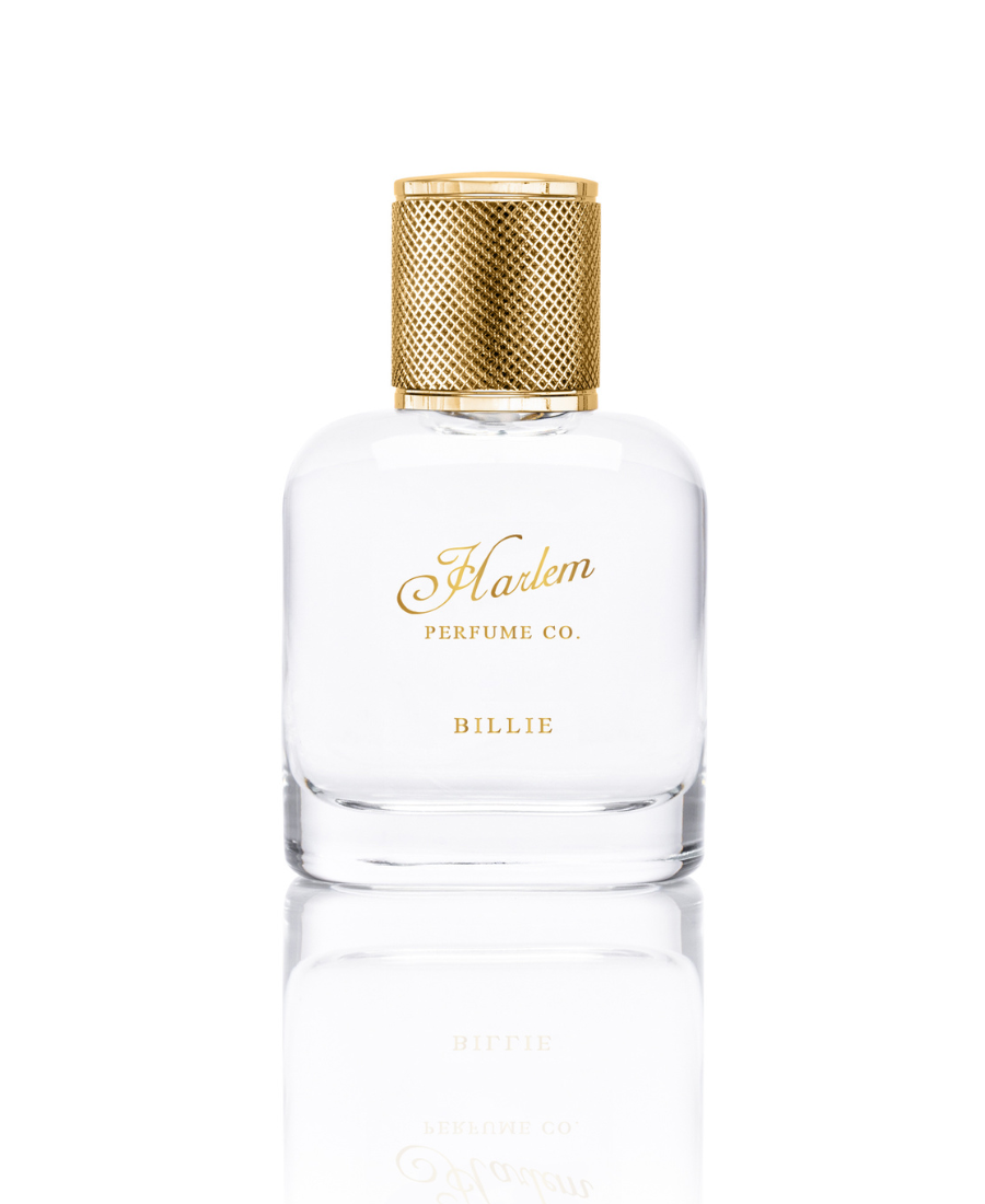 This is an image of our Billie eau de Parfum bottle against a white background. The bottle is clear with gold letters that say Harlem Perfume Co and the word Billie as the name of the fragrance.
