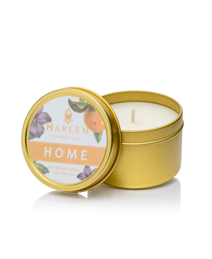 This is an image of our home travel candle in a gold metal tin.