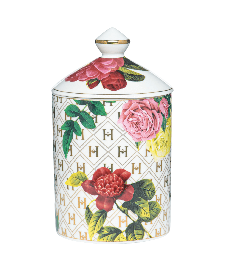 Our “Lady Day” White Floral Ceramic Luxury Candle with lid on a white background.