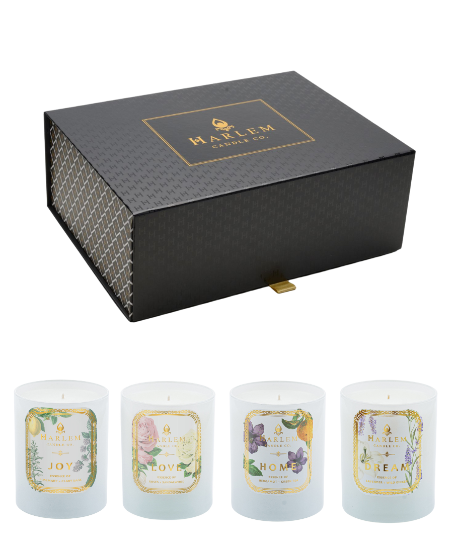 Image of our 4 Botanical Candles - Joy, Love, Home and Dream in front of the large gift the candles are packaged in.