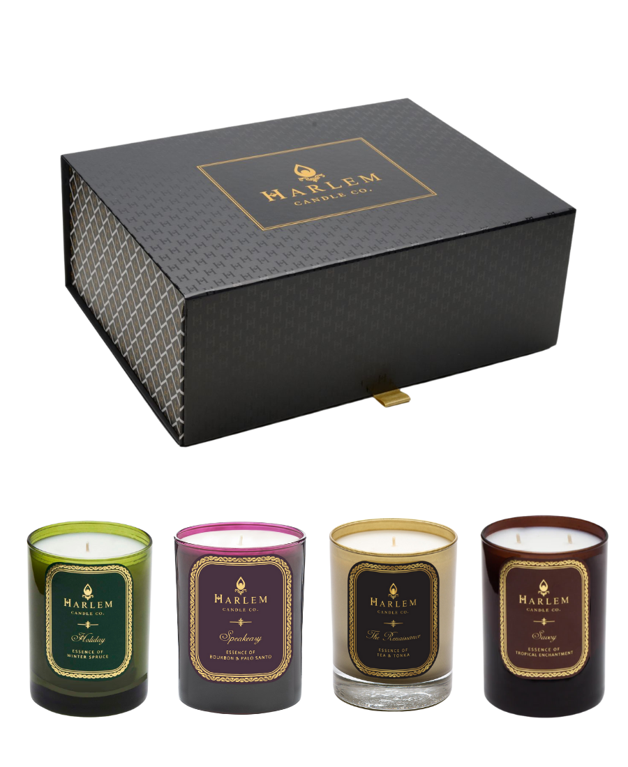 This is our Harlem Speakeasy Celebration Gift Box which pictures all  four full size 12 oz candles featuring our Holiday, Speakeasy, Renaissance and Savoy scents, on a white background.