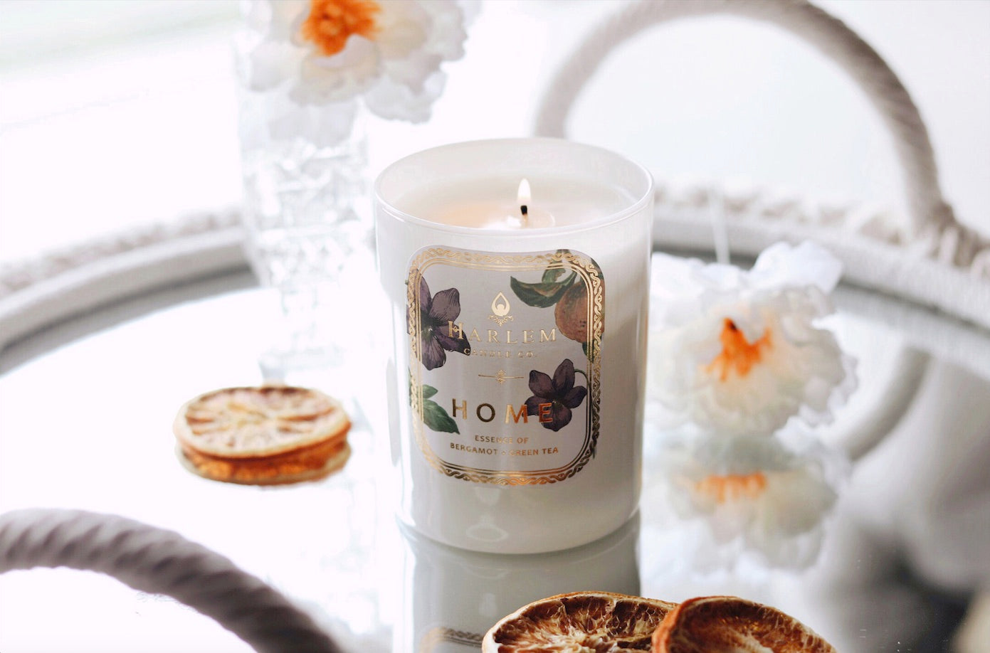 Photo of our Home candle from the botanical collection in a lifestyle setting
