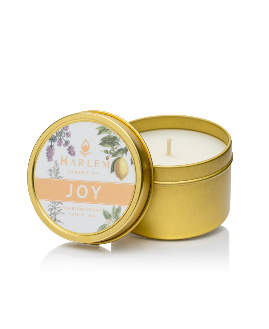 Our stunning Joy travel candle in a  gold metal tin.
