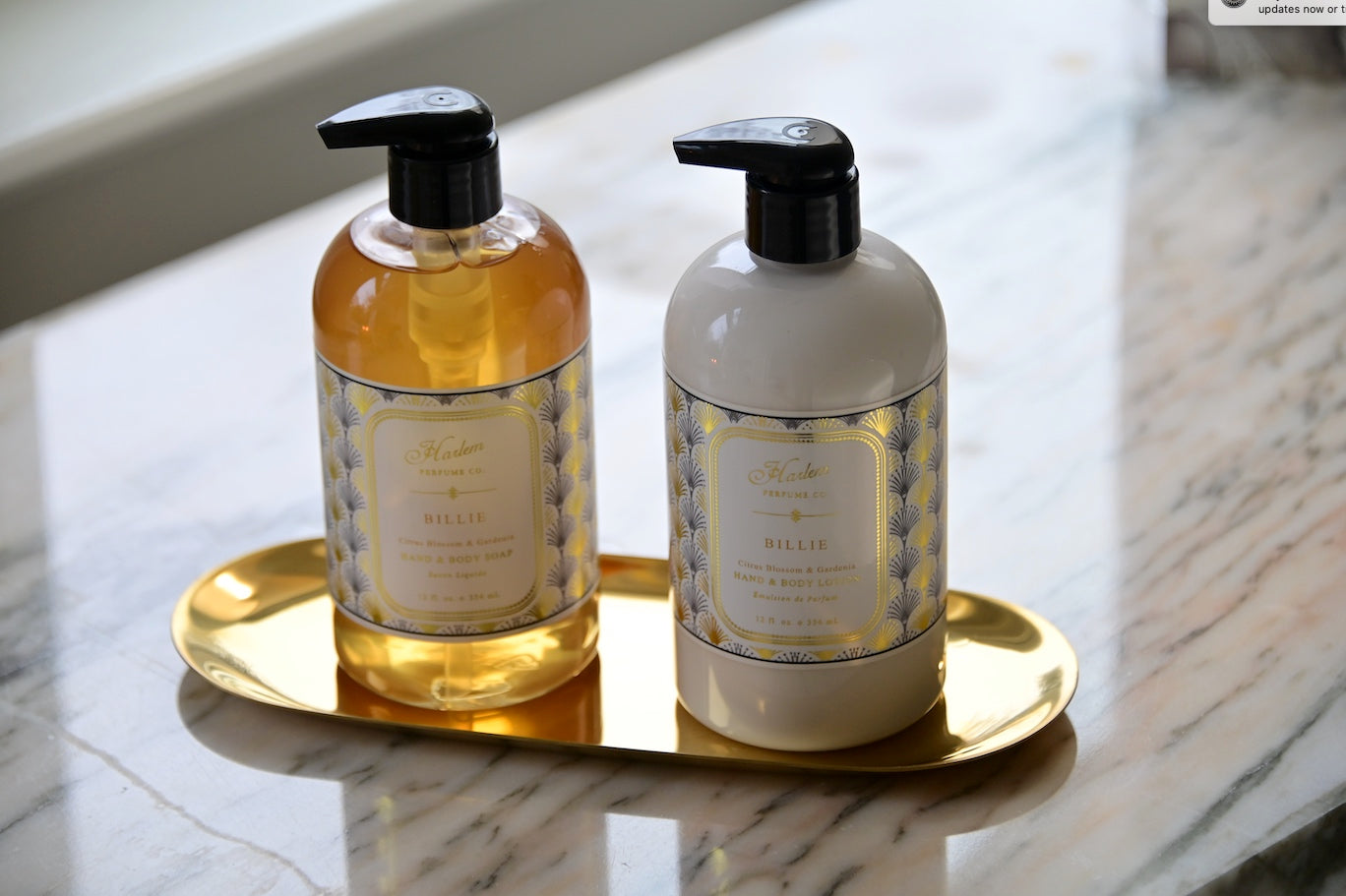 Lifestyle image of our Billie soap and lotion on a gold tray
