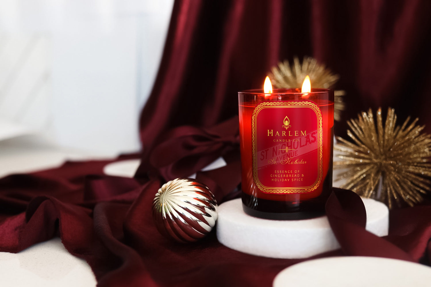 This is a lifestyle image of our St. Nicholas candle surrounded by Christmas ornaments.