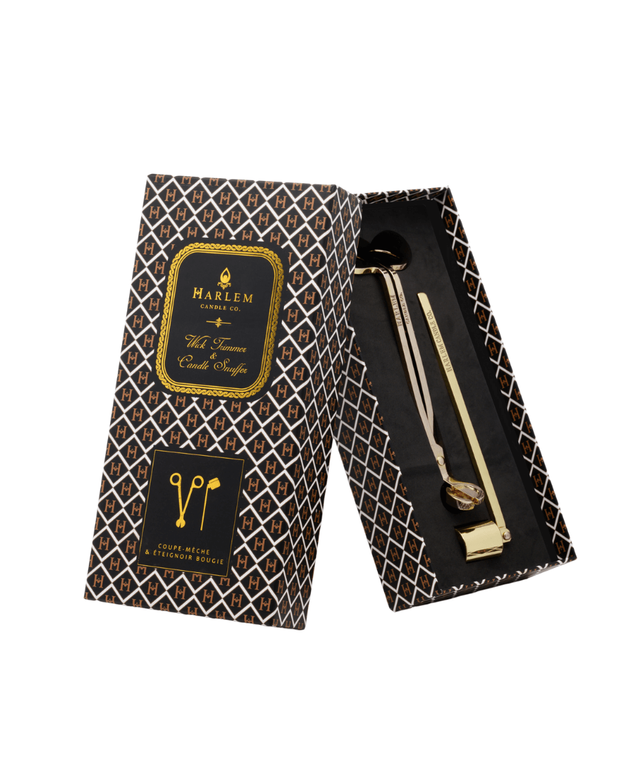 Gold Harlem Candle Co wick trimmer and candle snuffer set in elegant gold black and white box.